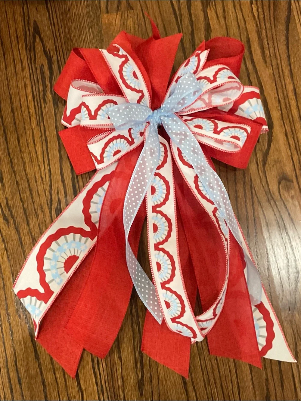 Festive Red Holiday Garland Bow with Light Blue Accent